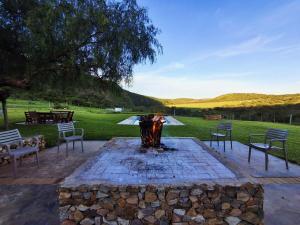 a fire pit in the middle of a yard at SoetHoek Farm Retreat in Alexandria