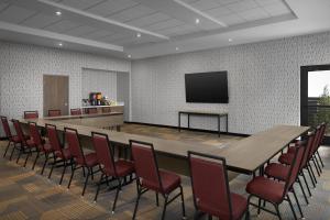 a conference room with a long table and chairs at Home2 Suites By Hilton Taylor in Taylor +32 photos