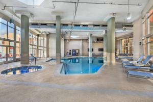 an indoor pool in a large building with lounge chairs at Bluegreen Vacations Club 36, an Ascend Collection Resort in Las Vegas