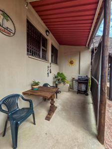 a patio with a wooden table and two chairs at Die Suidwester Gastehuis in Parys