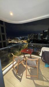 a table and two chairs sitting on top of a balcony at CfC in Casablanca
