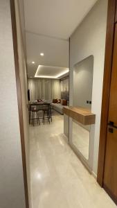 a kitchen and dining room with a table in a room at CfC in Casablanca +9 photos