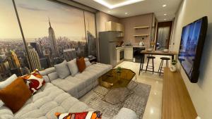 a living room with a couch and a view of a city at CfC in Casablanca