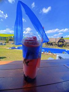 a drink in a plastic cup on a table at Isaan Country Retreat in Mukdahan +7 photos