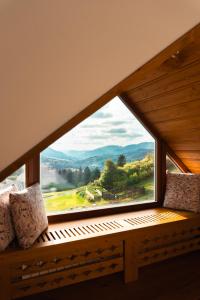 a window with a view of a mountain view at Apartmán 9 in Zázrivá