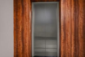an empty closet with a glass door in a room at Super Townhouse Richmond MG Road Metro Formerly Richmond Residency in Bangalore +36 photos
