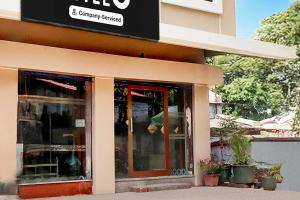 a man is standing outside of a building at Hotel O Tehsil Chowk Doon Hospital Formerly Hotel Comfort in Dehradun