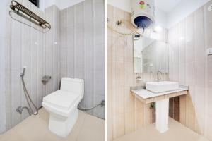a bathroom with a toilet and a sink at Hotel O Tehsil Chowk Doon Hospital Formerly Hotel Comfort in Dehradun