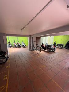 a group of motorcycles parked in a garage at AHHA Residence Kampot in Phumĭ Bœ̆ng Phlŏng (2)