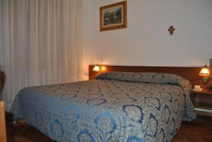Postel nebo postele na pokoji v ubytování Hotel Archimede