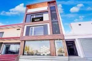 a store front with a wooden facade with glass windows at Townhouse Govardhan in Govardhan