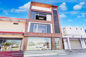 a building with a sign on the front of it at Townhouse Govardhan in Govardhan +38 photos