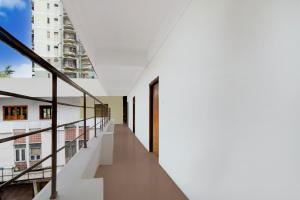 a view of the hallway of a building with stairs at Hotel O Lakdikapul Near Birla Mandir in Hyderabad