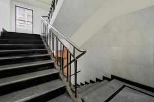 a set of stairs in a building at Hotel O Lakdikapul Near Birla Mandir in Hyderabad