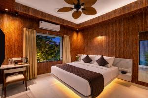 a bedroom with a large bed and a window at Shakuntalam Sagar - Luxury Boutique Lake View Hotel, Udaipur in Udaipur +29 photos