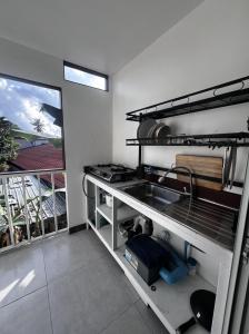 a kitchen with a sink and a stove at Ko Lipe Appartamenti in Ko Lipe +15 photos