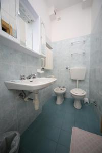 Koupelna v ubytování Hotel Lugano