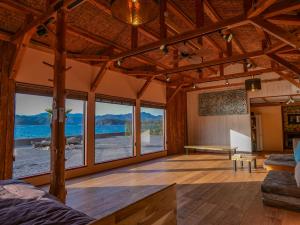 a living room with a view of the ocean at 2four Villa Costa in Minamiise