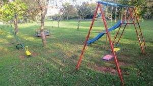 a group of swings in a park at Apartments Suzy in Vantačići