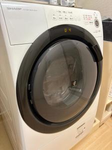 a white washing machine with its door open at FUJI Forest House103 in Gotemba +10 photos
