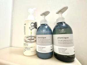 three bottles of cleaning products sitting on a shelf at FUJI Forest House103 in Gotemba