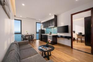 a living room with a couch and a table at DAO NGOC BEACH HOTEL Da Nang in Danang