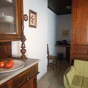 a kitchen with a counter with a bowl of fruit on it at Oianthis house in Galaxidi +23 photos