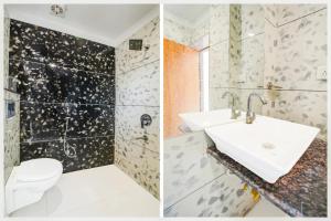a bathroom with a sink and a toilet at Collection O Ujjain City Centre Formerly Hotel Olive Inn in Ujjain