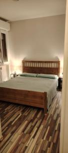 a bedroom with a large wooden bed in a room at Dreams in Pisa