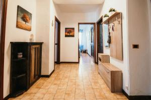 a hallway with a staircase and a room with a floor at Appartamento Ortensia - Meina in Meina
