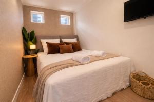 a bedroom with a bed with two towels on it at Nature Stay near Tilburg Uni & Center in Tilburg +22 photos