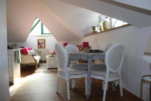 a dining room with a table and chairs at Hideaway Palais Auersperg in Salzburg