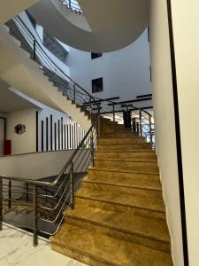 a staircase in a building with wooden steps at Alvina Complex in Tsaghkadzor +2 photos