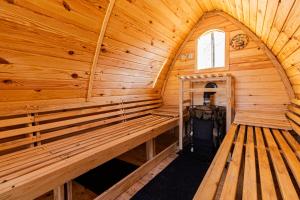 an inside view of a wooden cabin with a sauna at Cabana Alpinest & Sauna in Bran