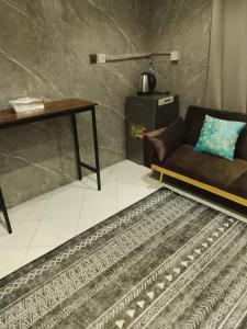 a living room with a couch and a table at DREAM Room , AJMAN in Ajman 