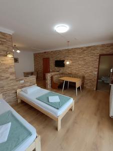 a living room with a bed and a table at Euro Accommodation in Debrecen