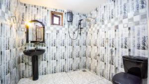 a bathroom with a sink and a toilet at Villa Swallow Nest in Sigiriya +30 photos
