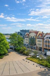 a view of a city with buildings and a street at Plac 14- Apartamenty i pokoje w centrum in Świnoujście