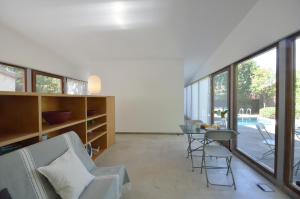 a living room with a couch and a table and chairs at Els Llorers - Ref.050 in Begur