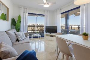 a living room with a couch and a table at Ag Eden Resort in Gandía