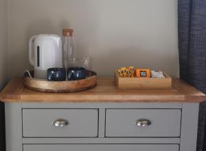 a counter with a coffee maker on top at St Michaels Reach Guest House in Marazion +48 photos