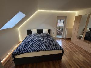 a bedroom with a large bed in a room at Ferienwohnung Grünblick am Katschbach in Teufenbach