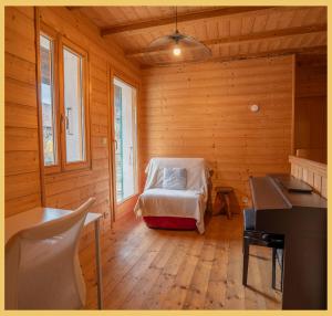 a room with a bed in a wooden room at Maison Méserier I T3 I Publier in Publier