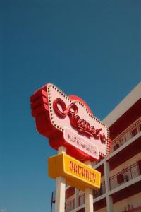 a sign for a restaurant in front of a building at Romeos Ibiza - Adults Only in San Antonio Bay +45 photos