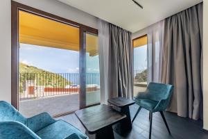a living room with a view of the ocean at Dimora Eledia in Taormina