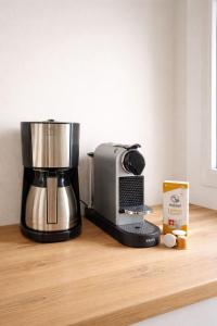 a coffee maker sitting on top of a wooden counter at Tante Schmidt 4 in Staberdorf