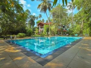 an image of a swimming pool at a resort at The Villa Green Inn in Negombo