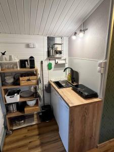 a small kitchen with a sink and a counter at Ferienhaus Elda in Lahnstein