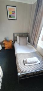 a bedroom with a bed with a tray on it at The Grapes in Southampton