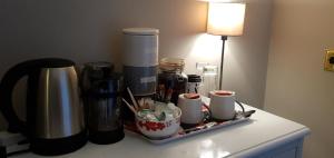 a tray with cups and other items on a table at The Grapes in Southampton